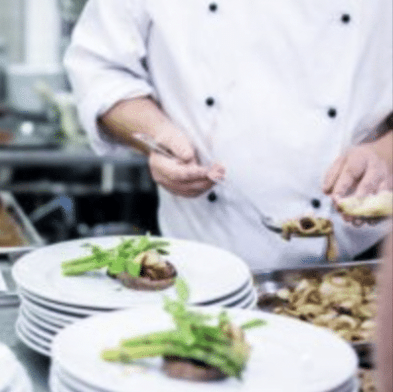 chef preparing food in a kitchen in wokingham