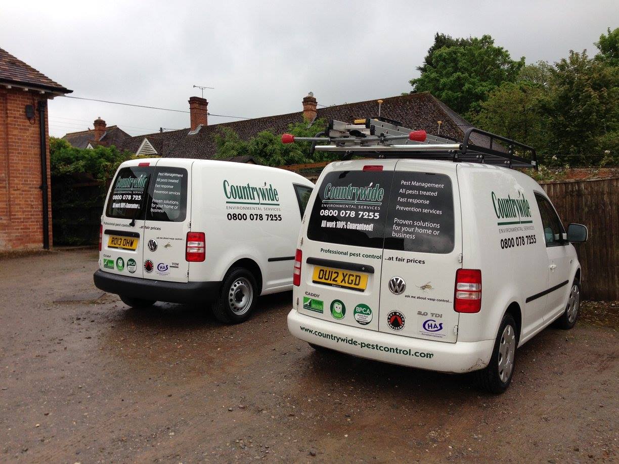 Countrywide Pest Control vans parked at a squirrel pest control site